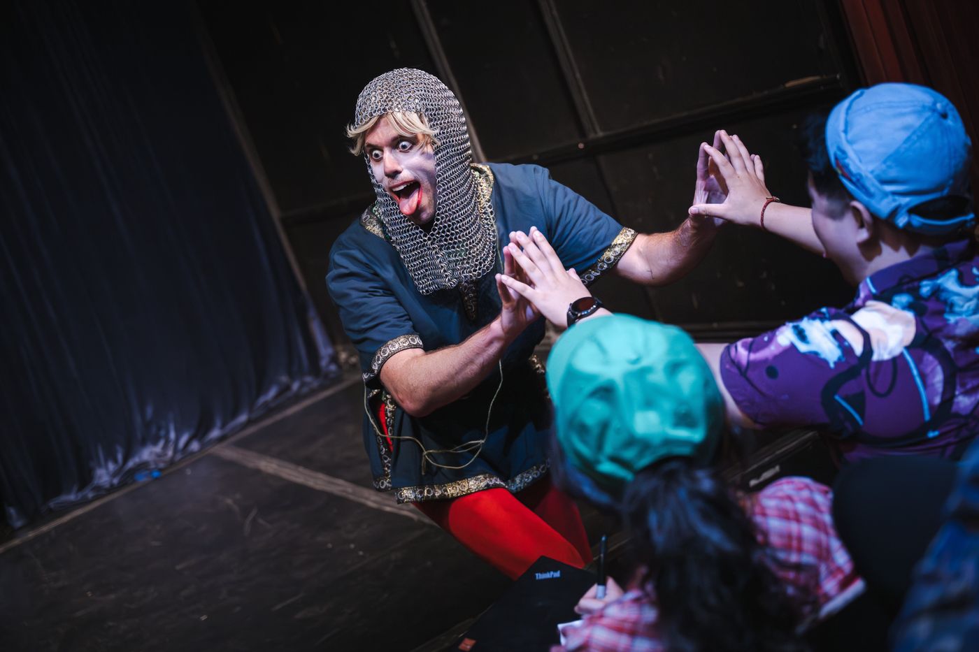 Grant O'Connell in Good Knight - high-fiving the audience